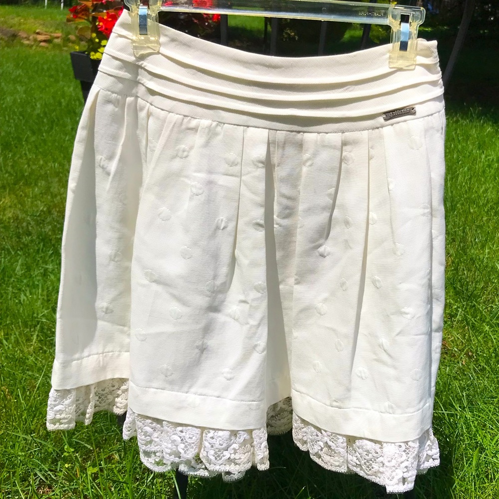 Never worn white Galliano skirt with lace trim.